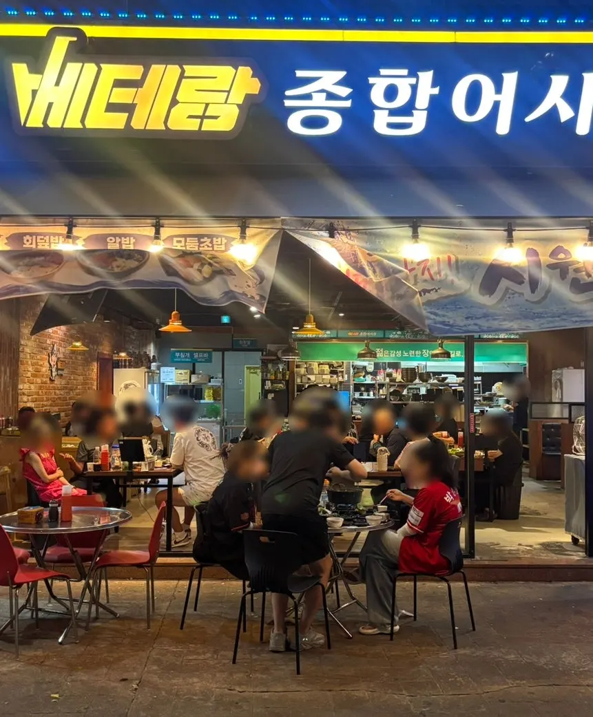 Outdoor tent tables packed with customers