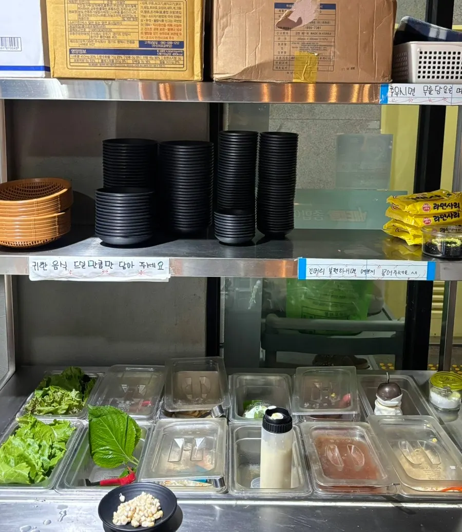 Self-serve bar with lettuce wraps and side dishes
