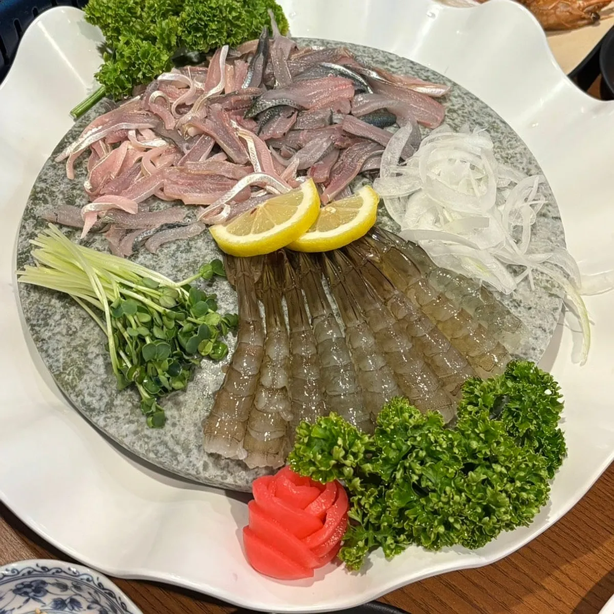 Plate of raw shrimp sashimi and gizzard shad seogosi, half-and-half