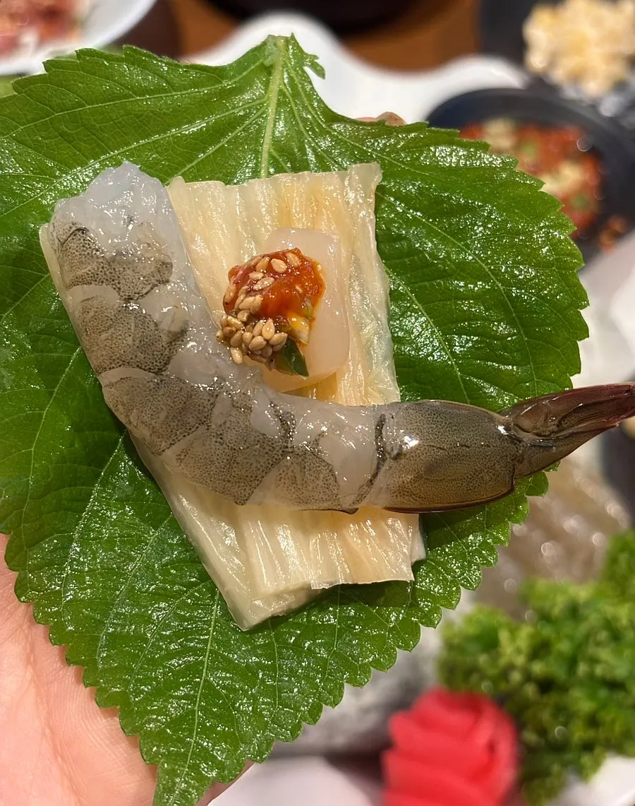 Perilla leaf wrap with white kimchi and raw shrimp