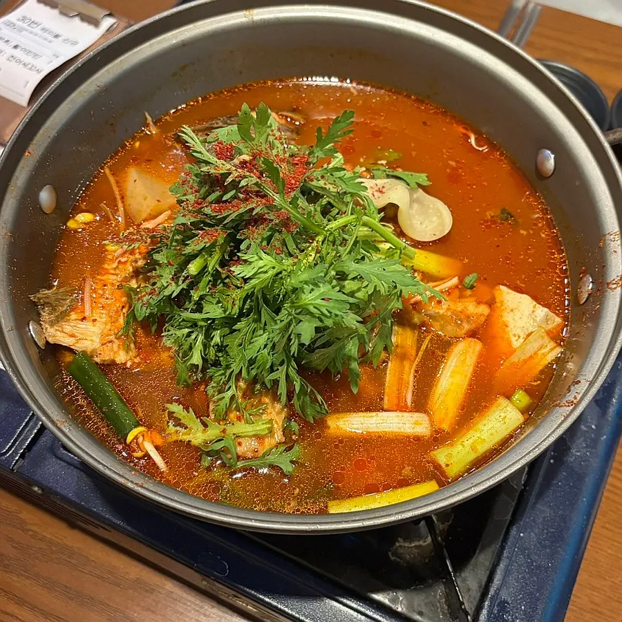 Pot of seodari spicy fish stew before boiling