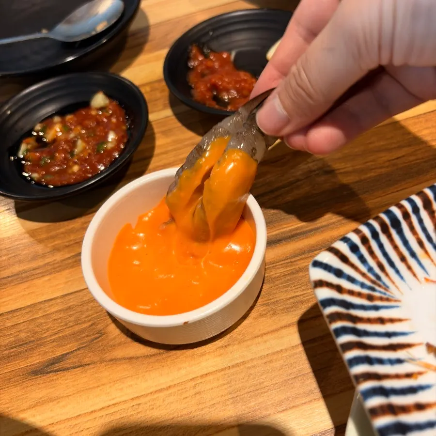Raw shrimp sashimi served with buldak mayo sauce