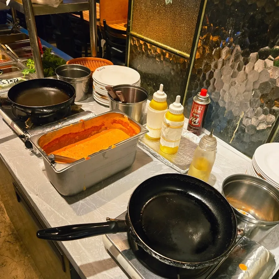Self-bar with lettuce wraps, sauces, and white kimchi