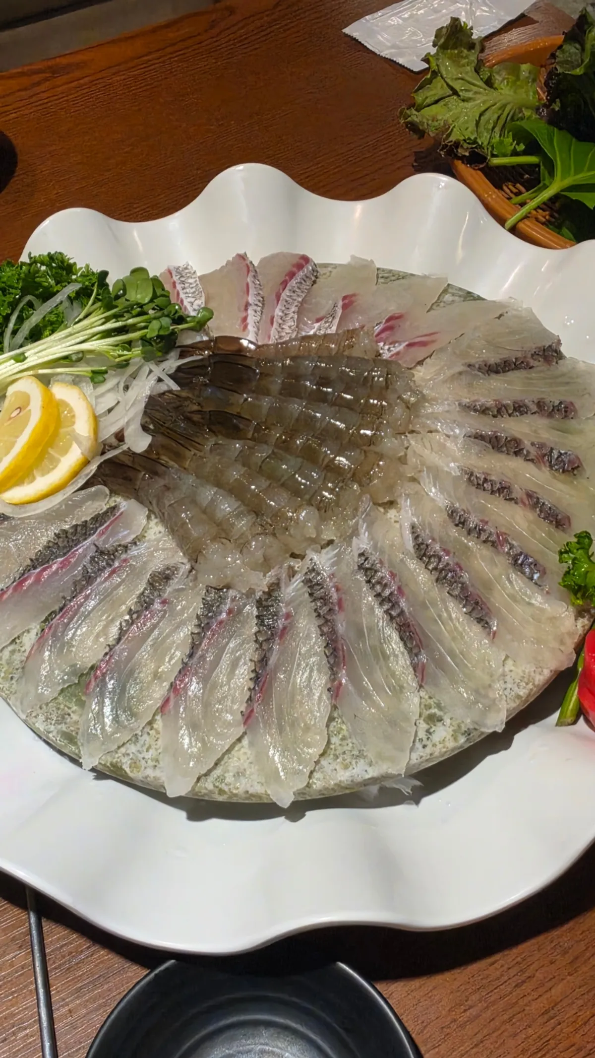 A plate of raw shrimp sashimi and red snapper live fish sashimi half-and-half (small)