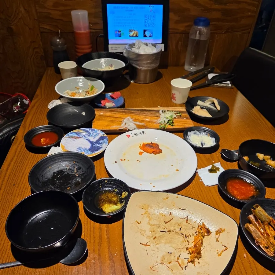 An emptied plate of salt-grilled shrimp