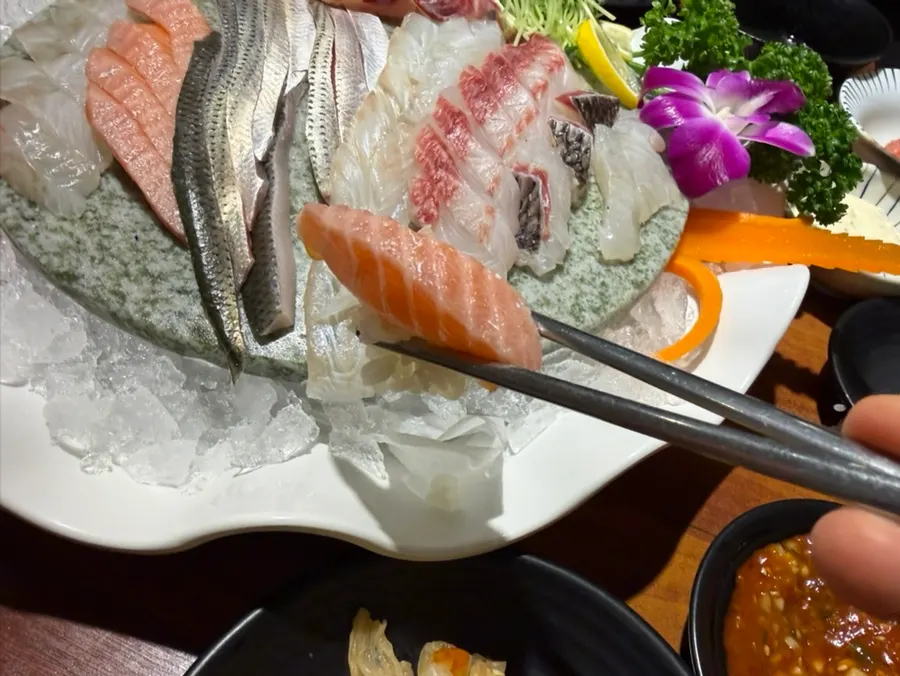 Mullet sashimi wrapped in seaweed with wasabi-soy sauce