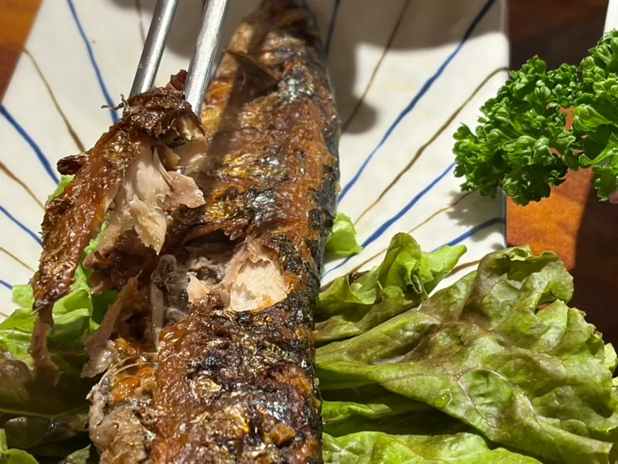 Freshly grilled saury served on the house