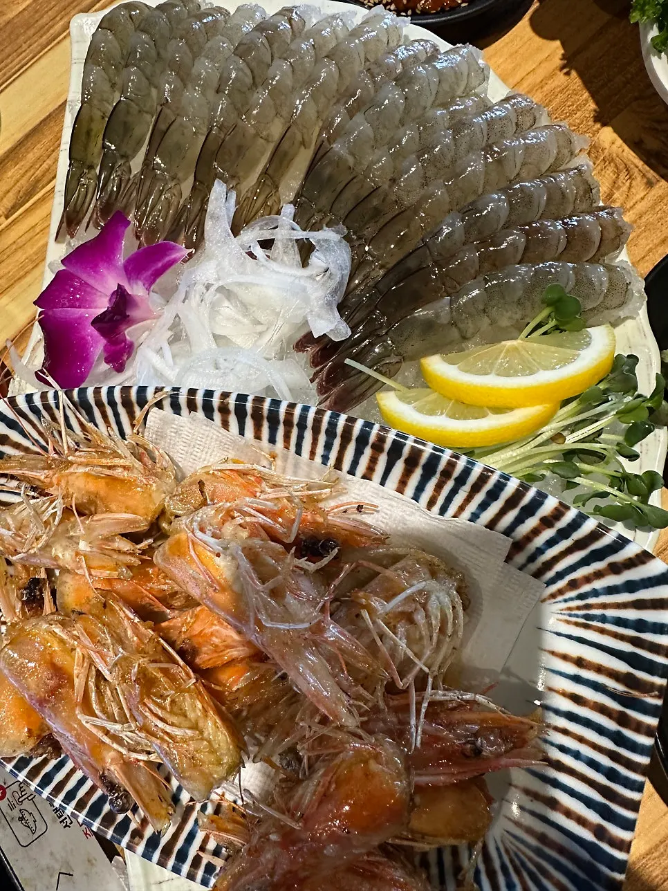 Raw shrimp sashimi and butter-grilled shrimp heads