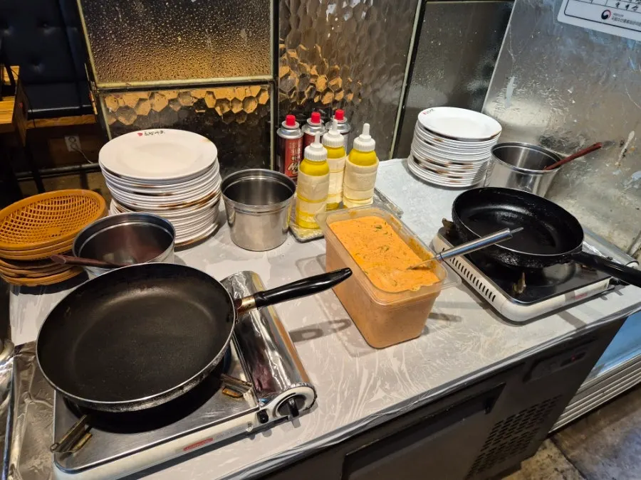 Self-serve bar with corn salad and aged kimchi