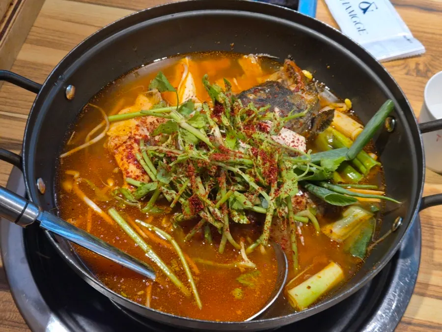 Self-serve kimchi pancake cooked at the table