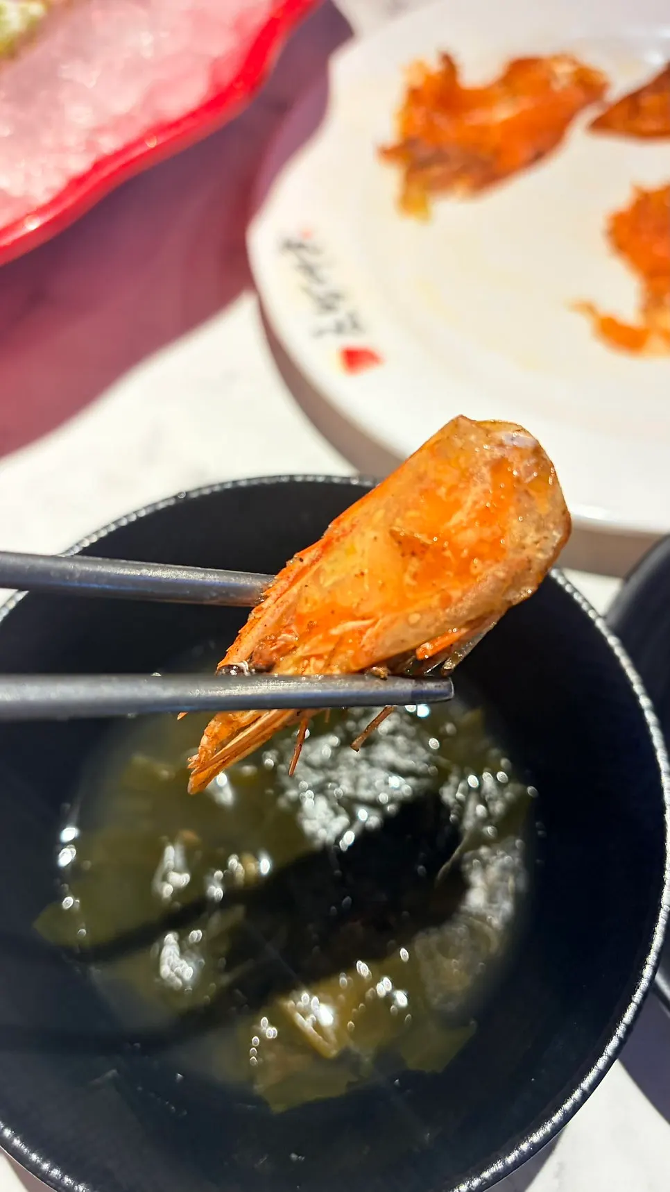 Crispy fried shrimp heads served on the side