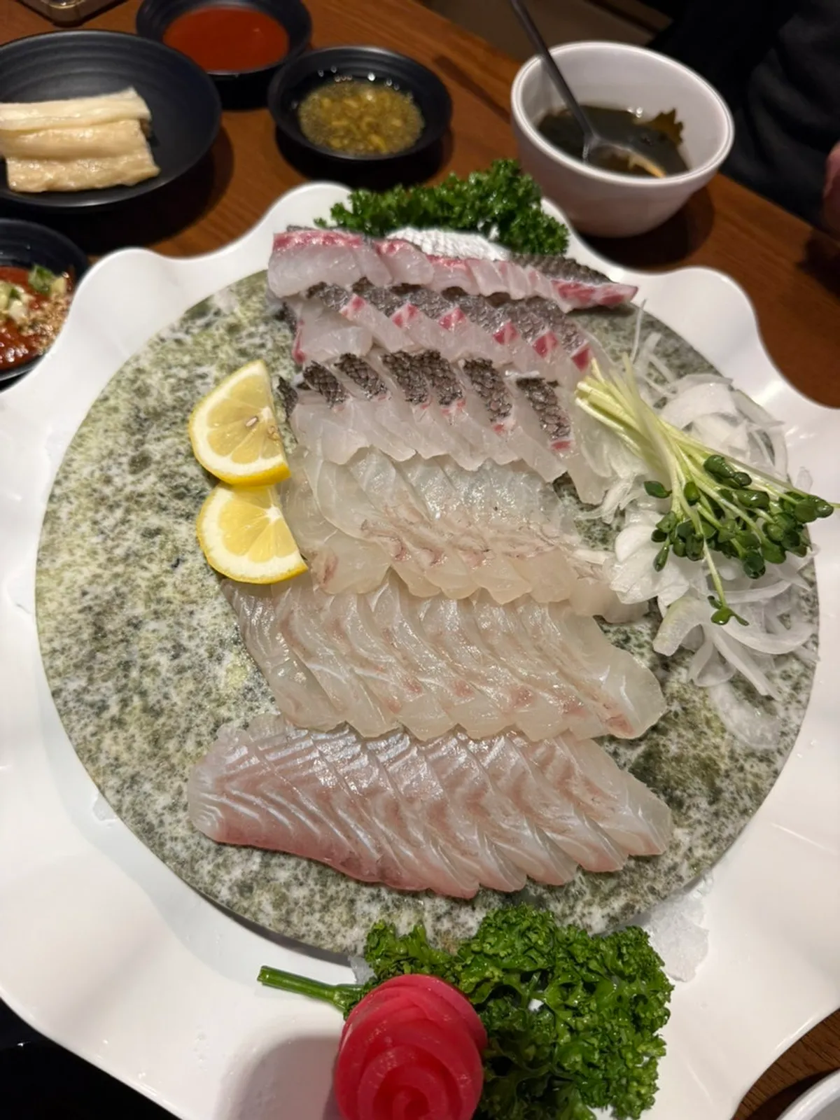 Plate of red snapper and flounder half-and-half sashimi platter