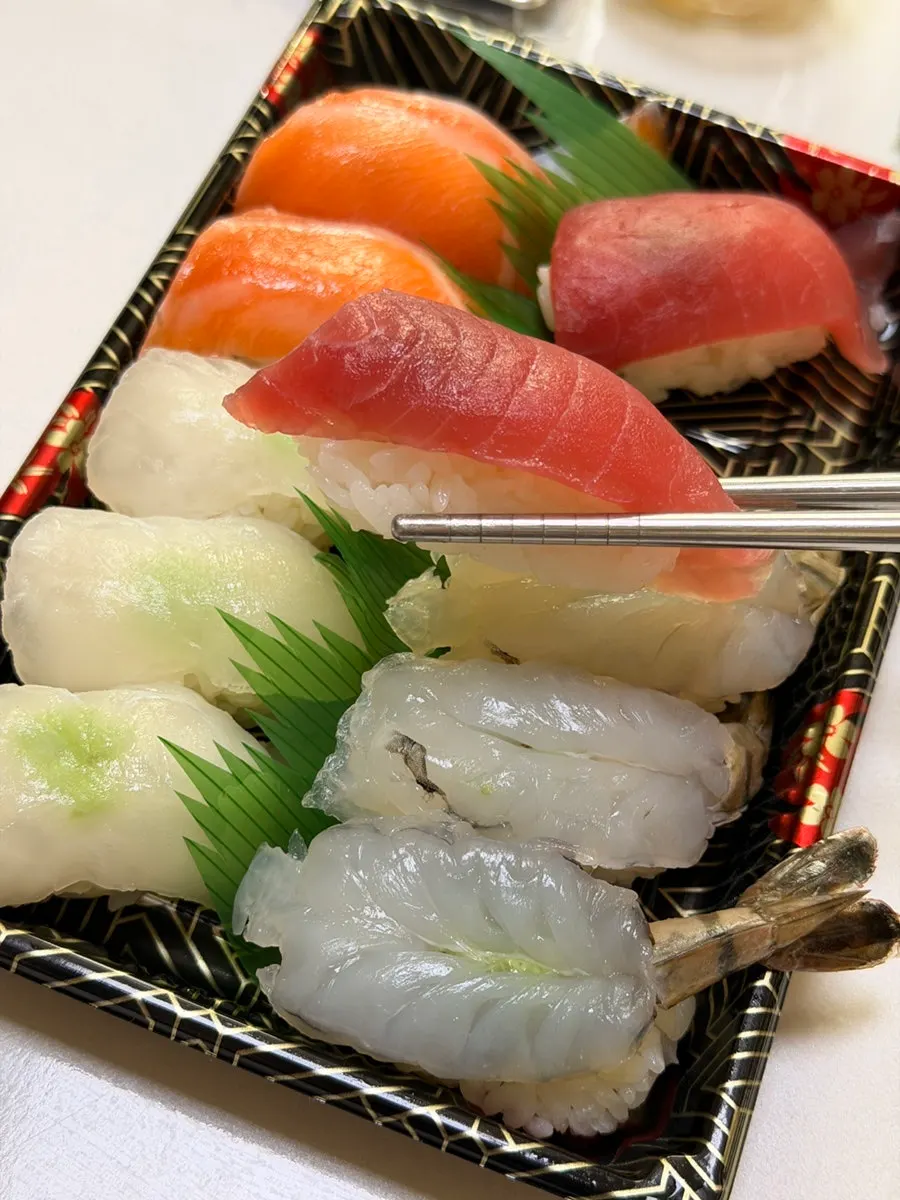 Close-up of takeout sushi unpacked at home