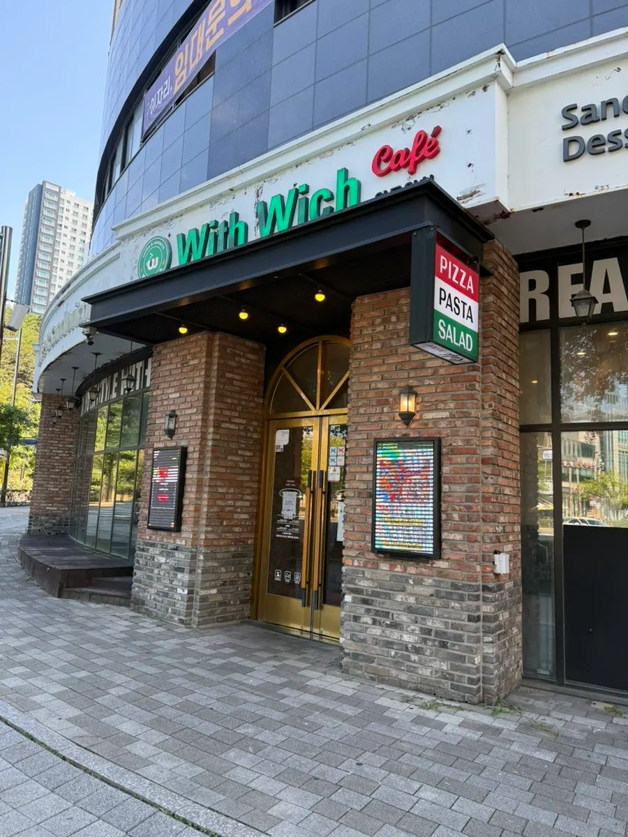 Brick exterior of Withwich on the first floor of The Blue City