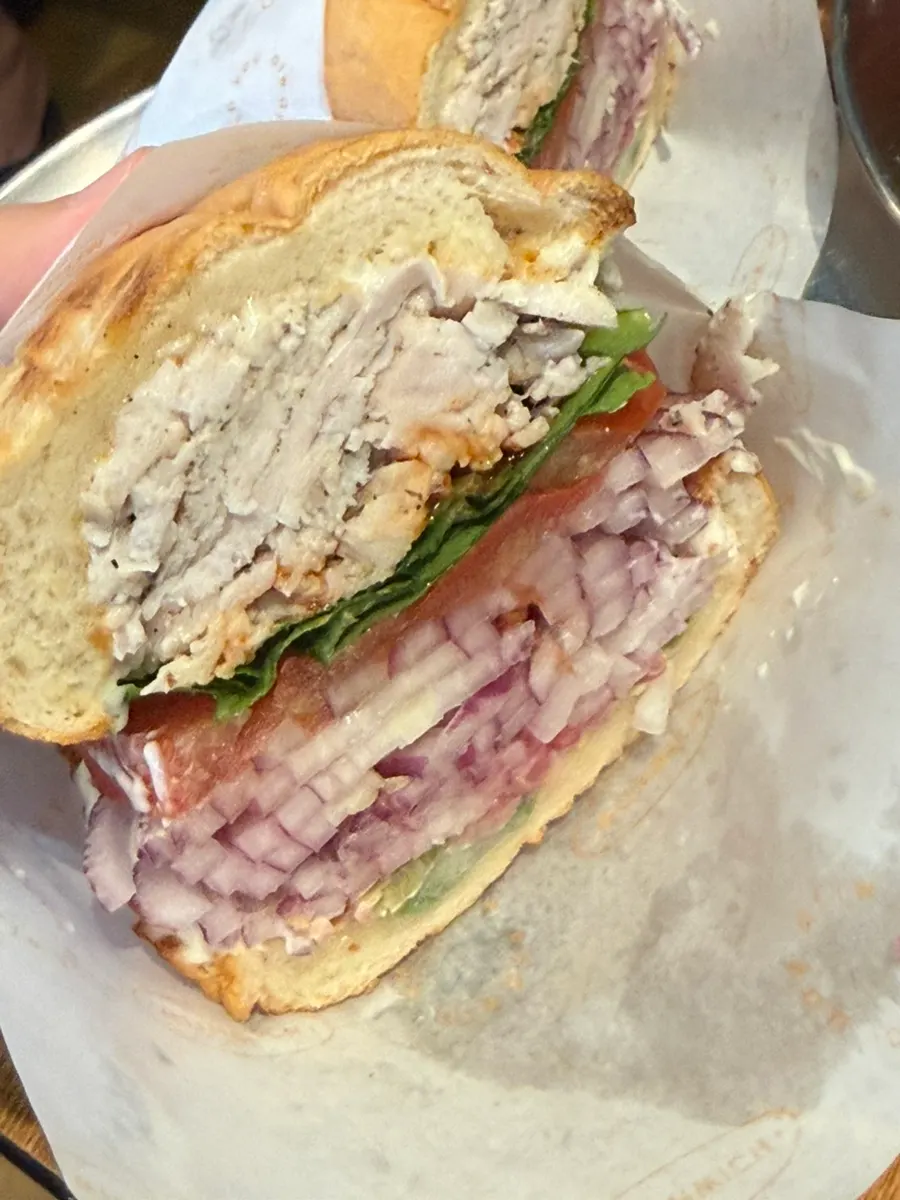 Cross-section of thick sous vide chicken breast with vegetables