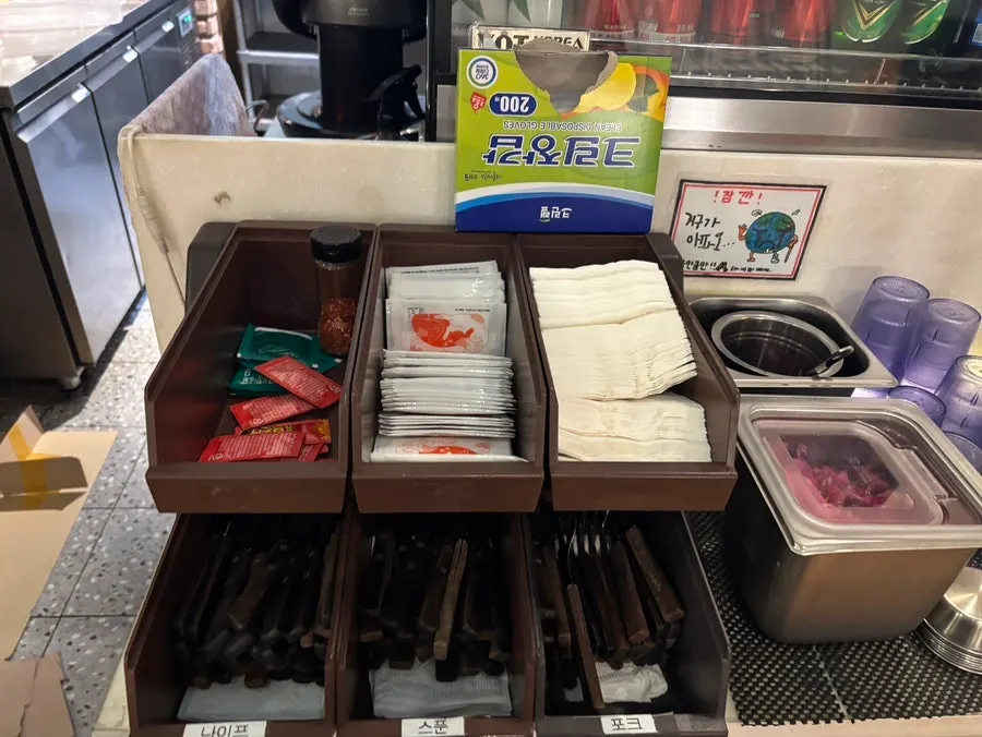 Self-serve bar with utensils and pickles