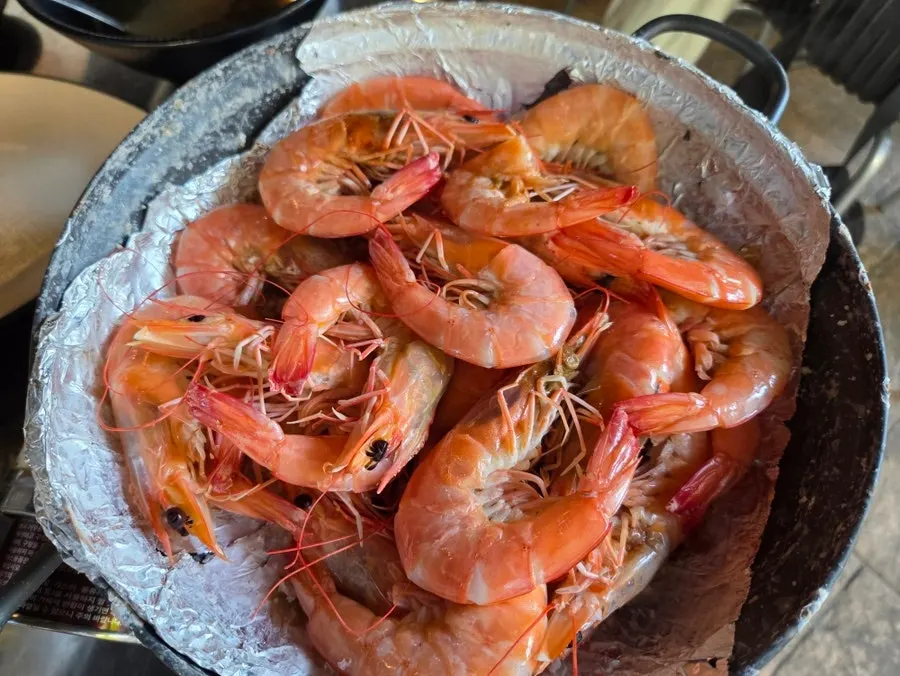 Shrimp turning red as they cook on the burner