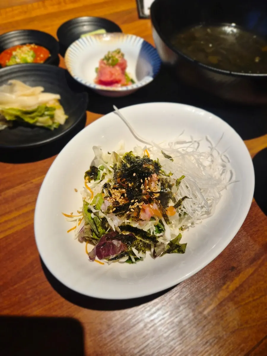 Seasoned raw fish salad served as a basic side dish
