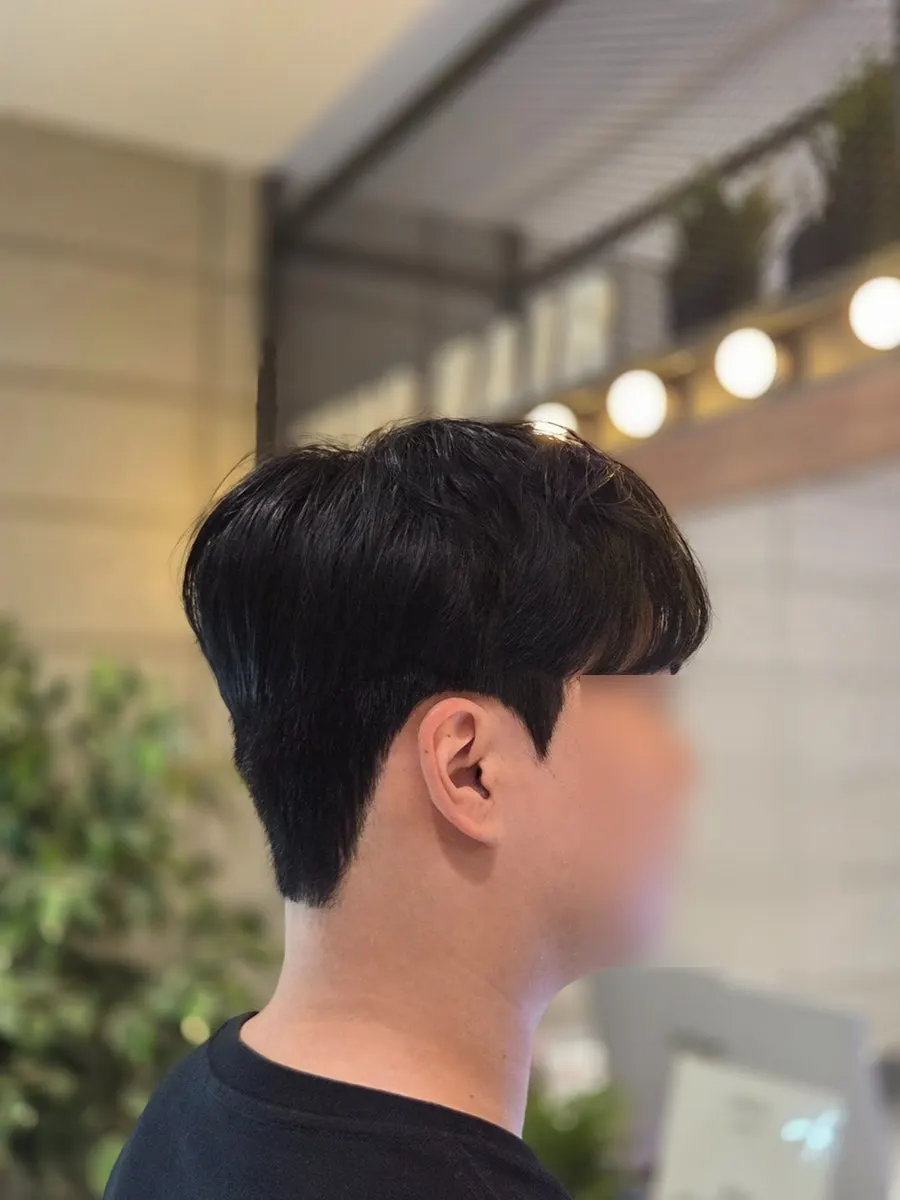 Neatly styled men's after hairstyle