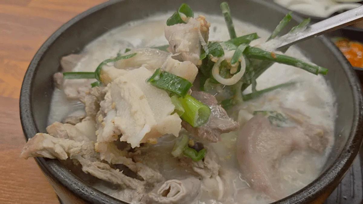 Set meal spread with boiled pork, chapsundae and sundaeguk