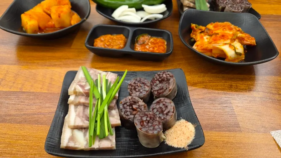 Spicy sundaeguk with chili oil swirling on top