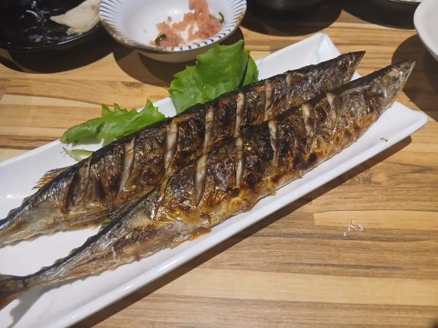 Grilled gizzard shad served with rice
