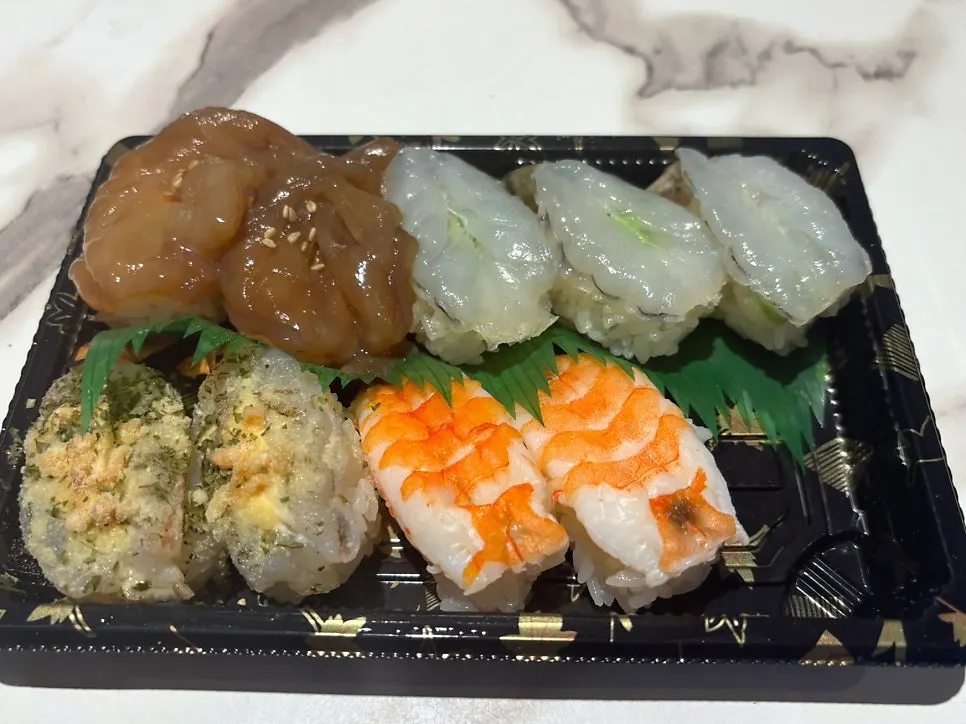 Assorted shrimp sushi, salmon tataki sushi, and halibut sushi