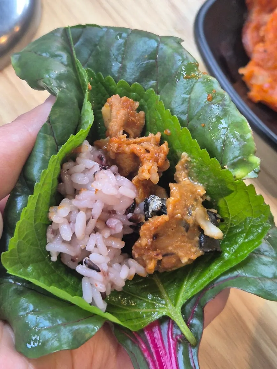 Squid pork wrapped in lettuce and perilla leaves