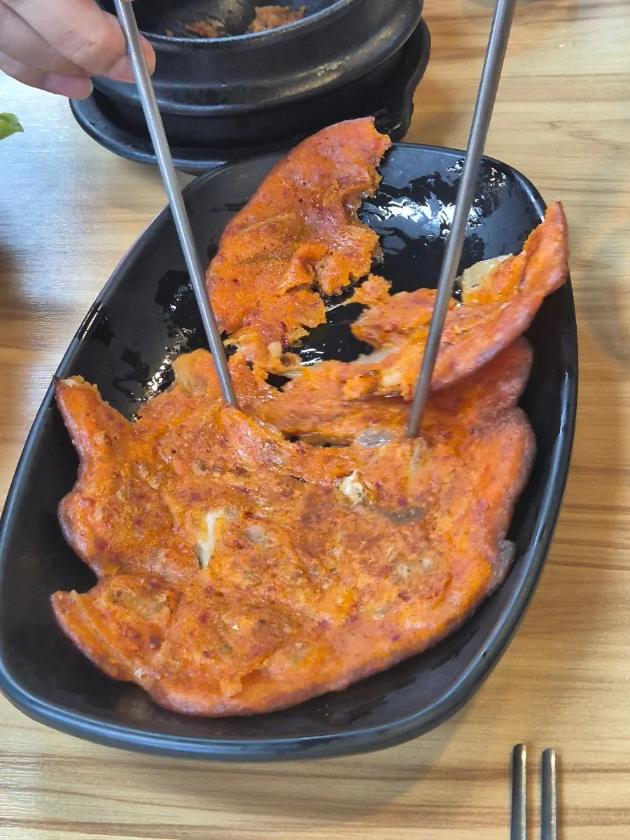 Kimchi pancake and assorted Korean side dishes