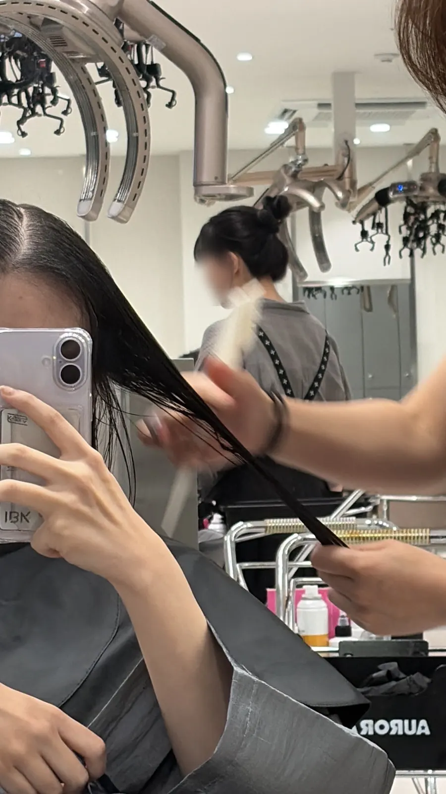 Applying the Ojua protein care product to the hair