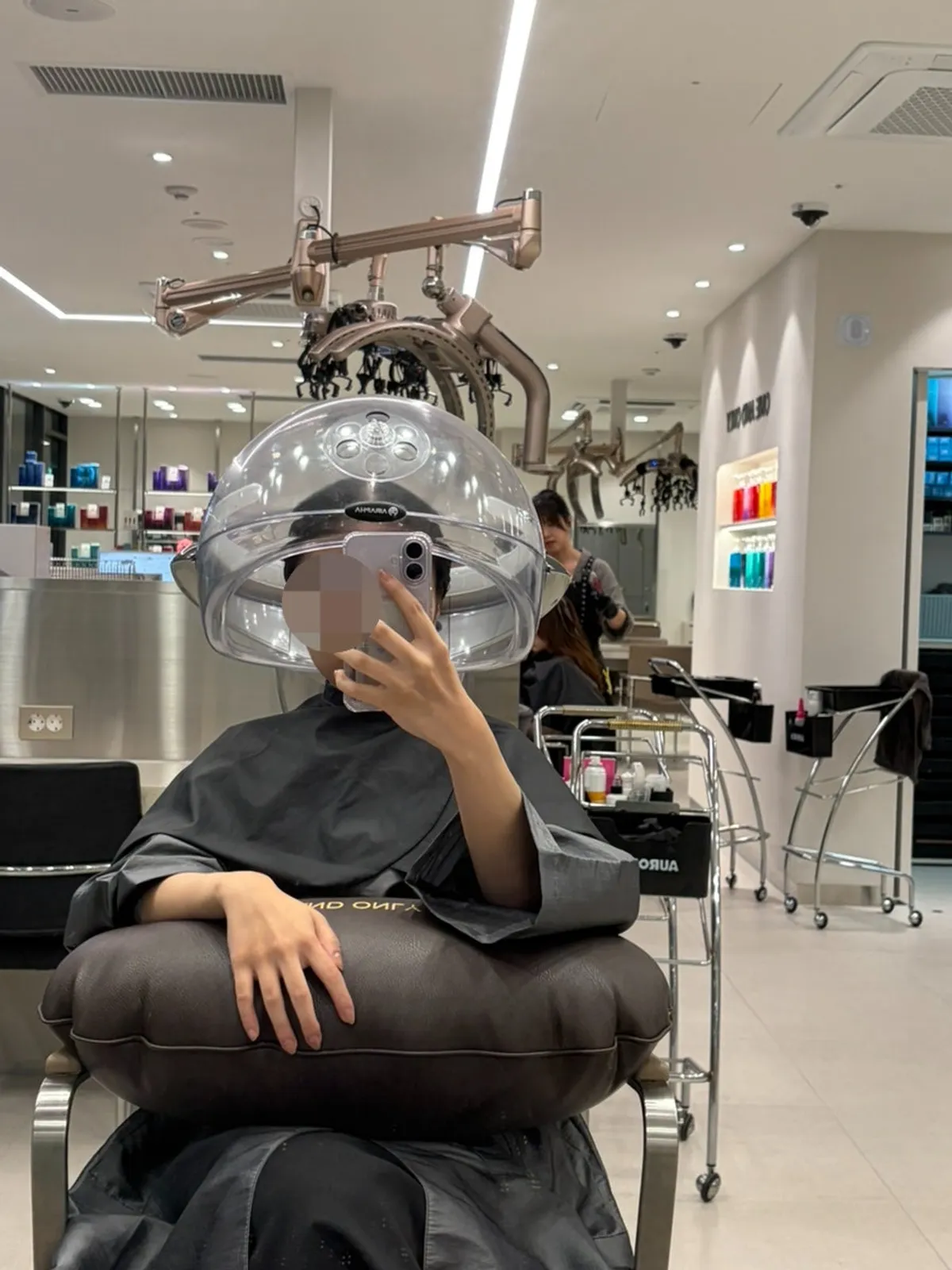 Applying a scalp ampoule followed by steam for moisture