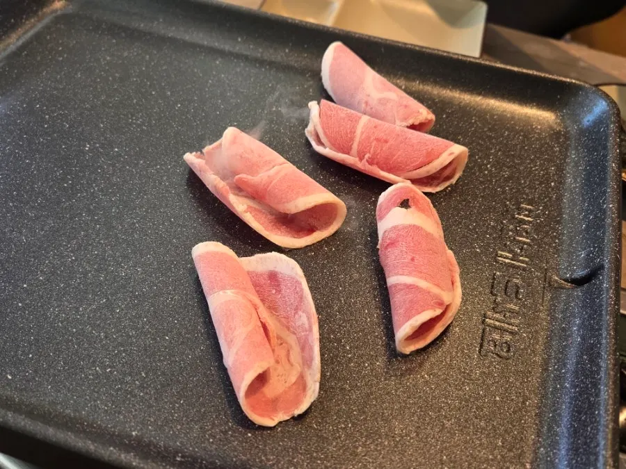 Duck chadol slices cooking on the grill