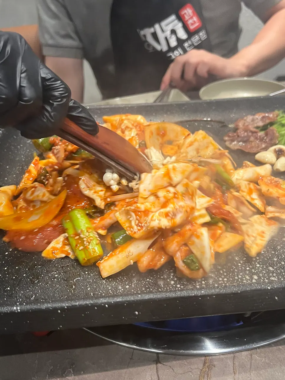 Raw duck stir-fry cooking with vegetables