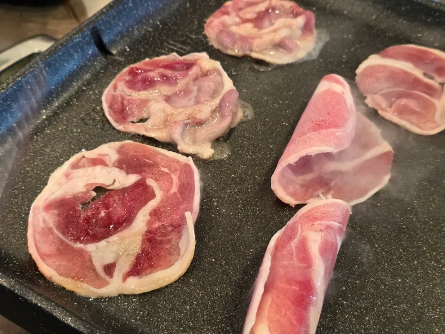 A piece of duck chadol dipped in special sauce
