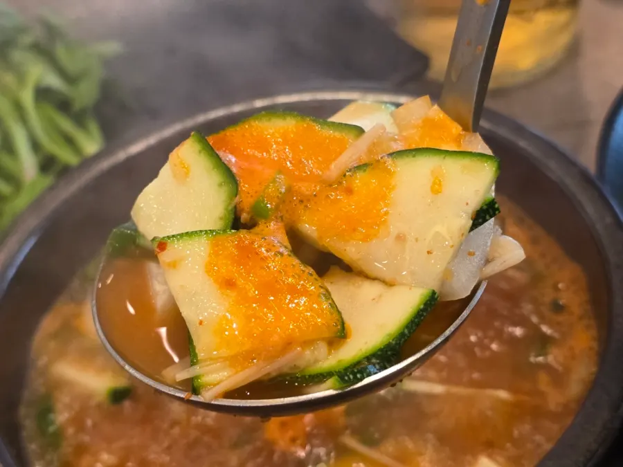 A bowl of doenjang jjigae to eat alongside the meat