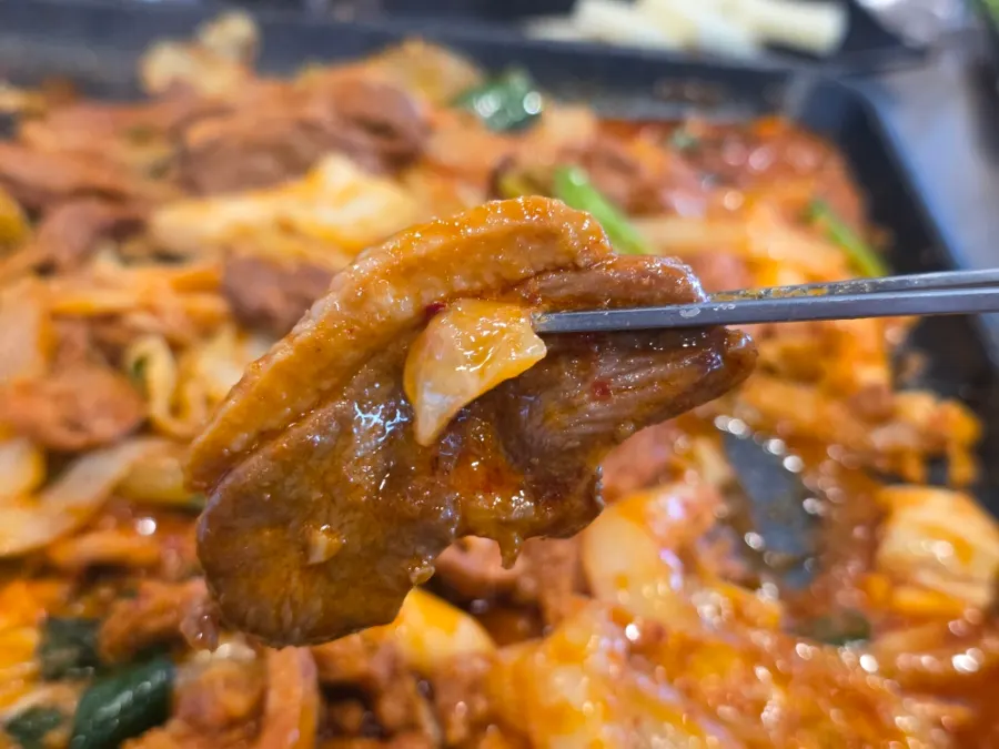 Finishing the meal after enjoying both duck chadol and stir-fry