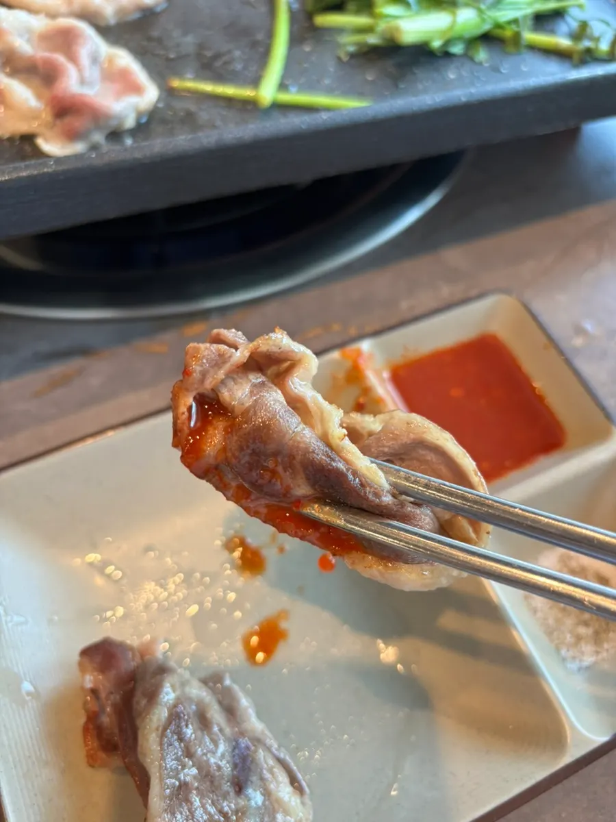 A piece of duck chadol with the house special sauce