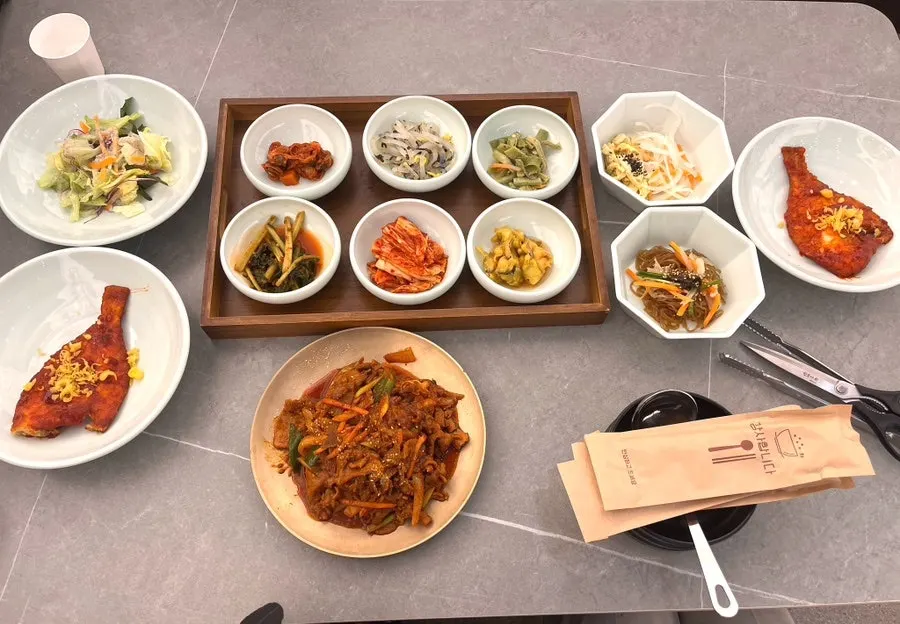 Table spread with basic banchan and pork stir-fry