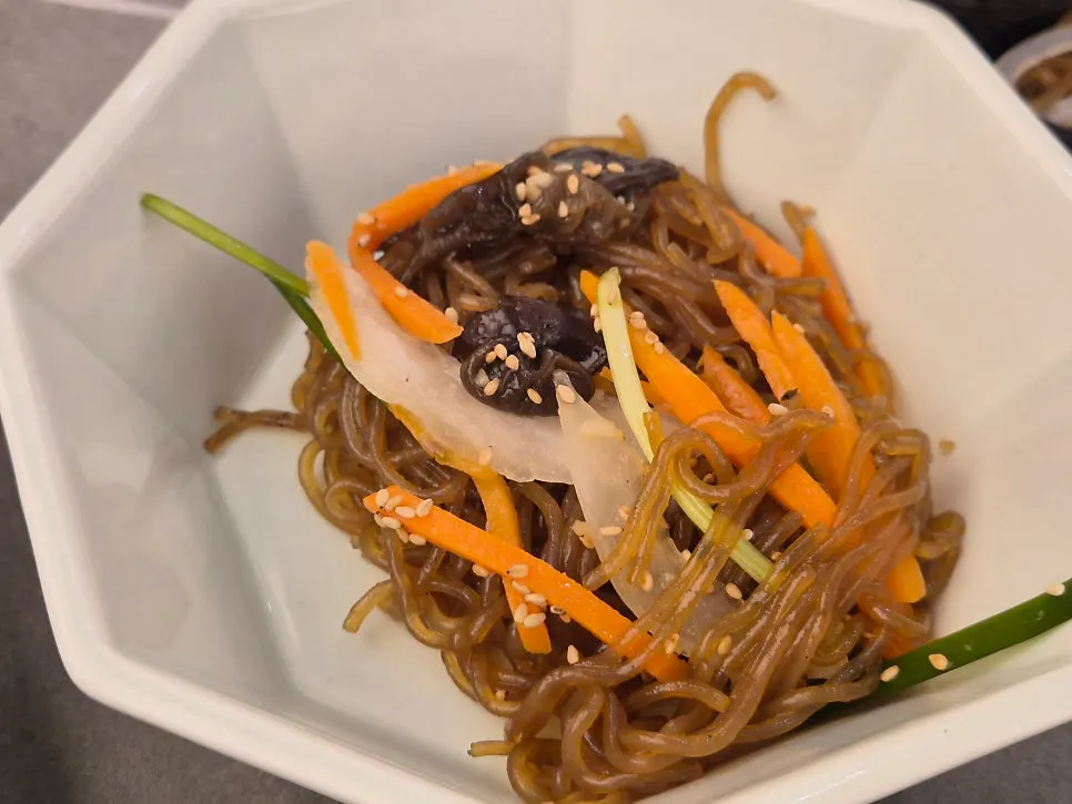 Japchae and mung bean jelly side dishes the child loved