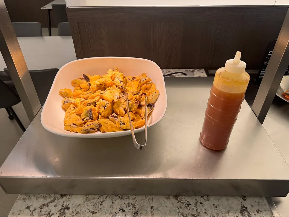 Containers of side dishes at the self-serve bar