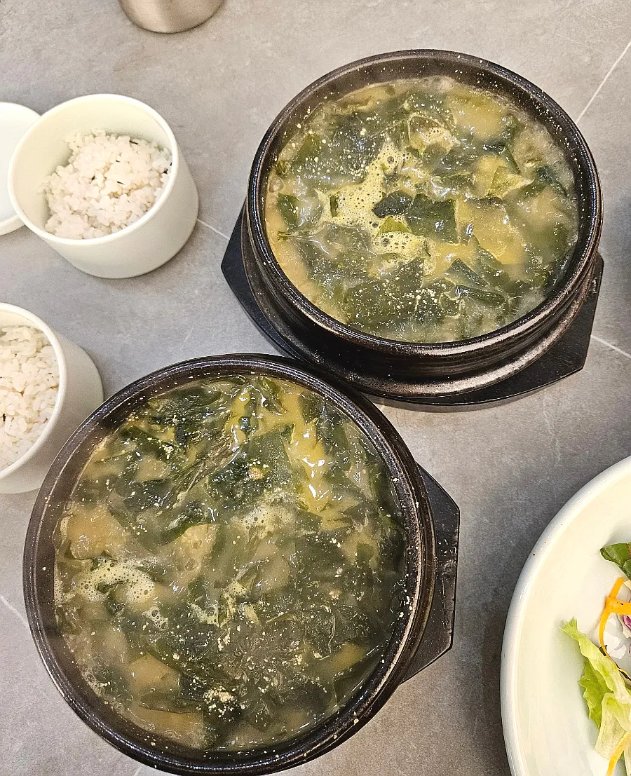Table with a child enjoying japchae