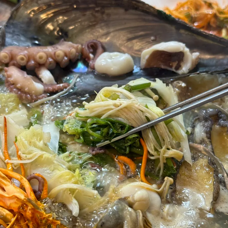 Plump octopus and clams removed and prepared for eating