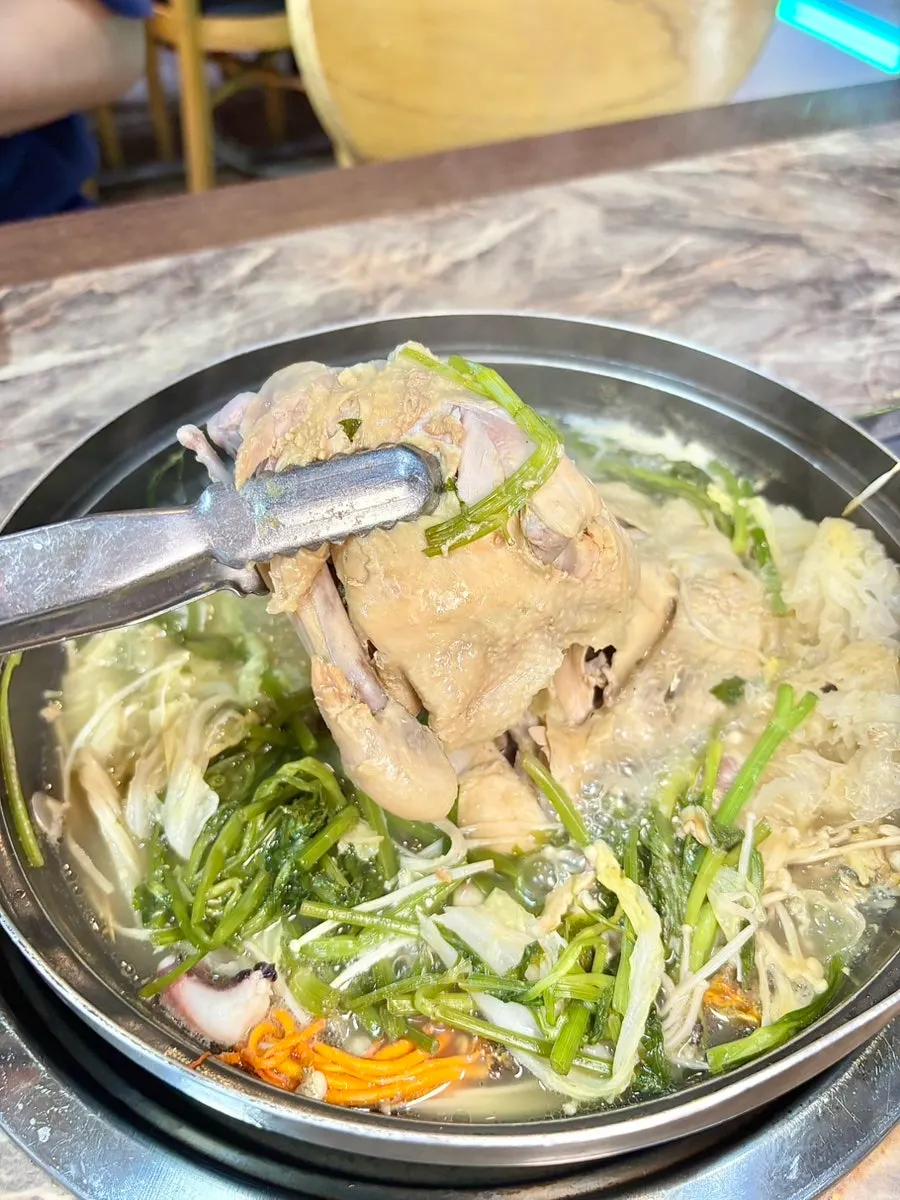 Chicken slow-cooked to softness in the broth