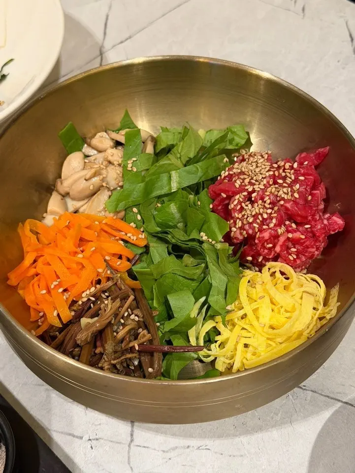 Yukhoe bibimbap with rice and gochujang served separately