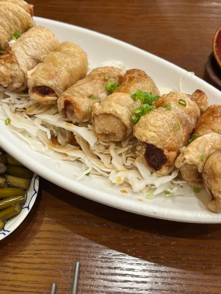 Chicken-skin gyoza with cabbage and sauce