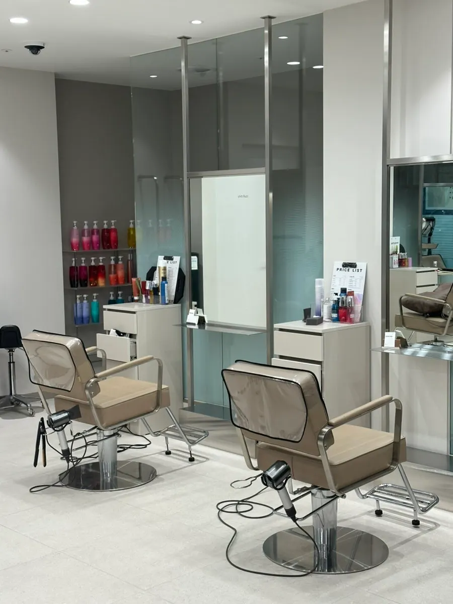 Beige-toned service area inside the salon