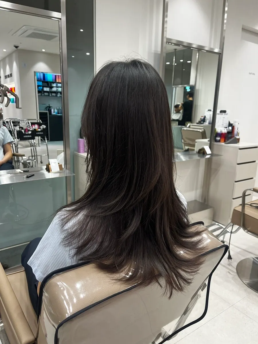 Back view showing the original length before the cut