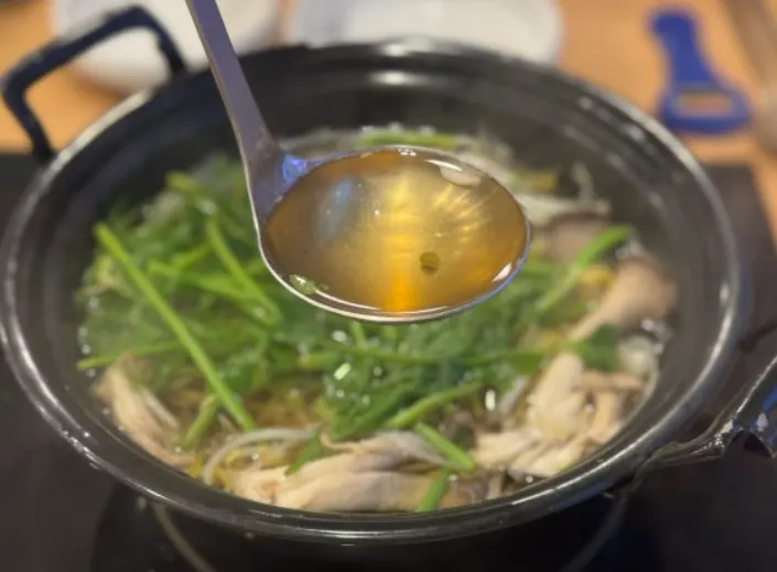 Hot pot broth boiled with a generous amount of minari