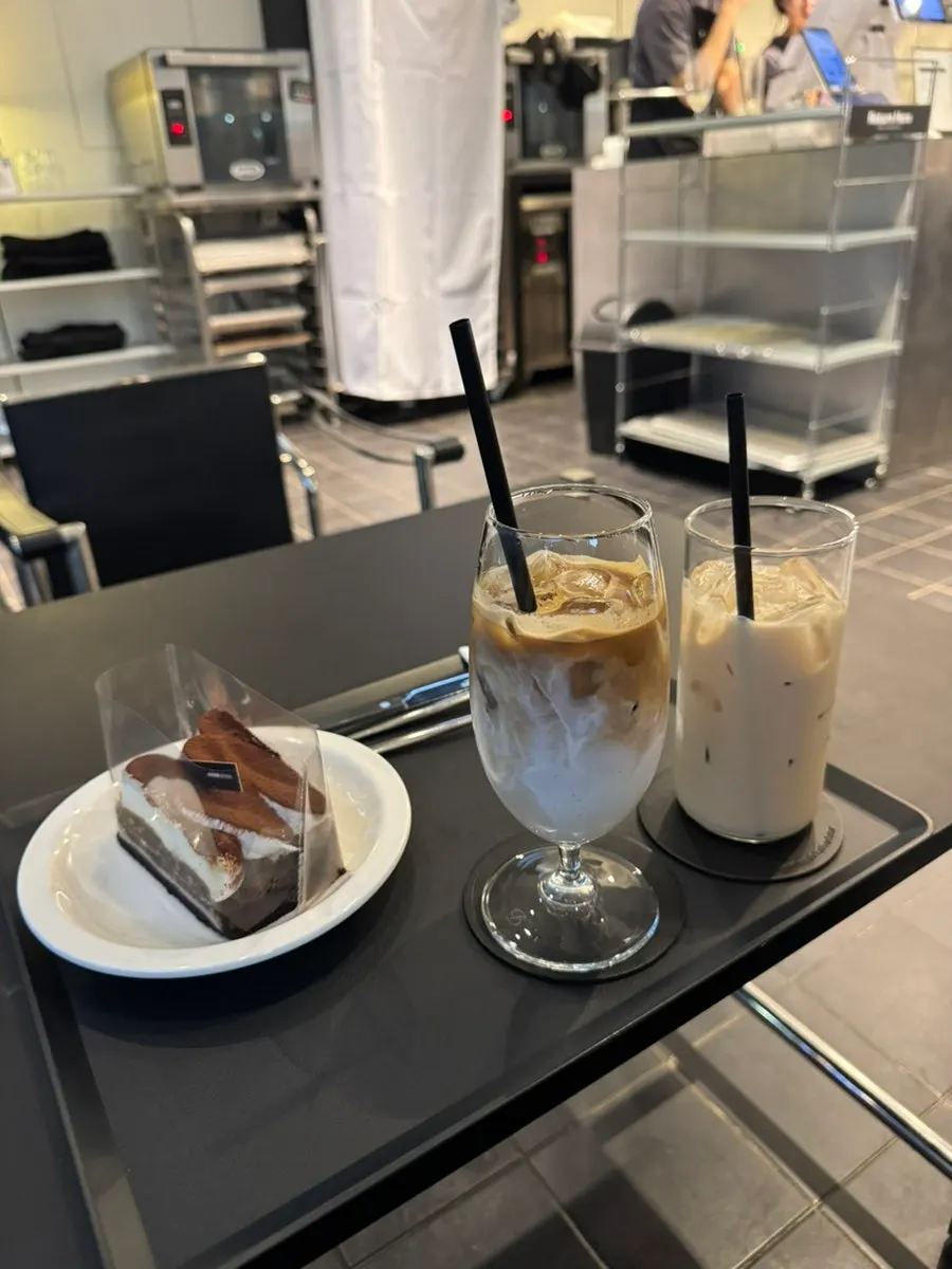 Helsinki Latte, milk tea, and tiramisu on one tray