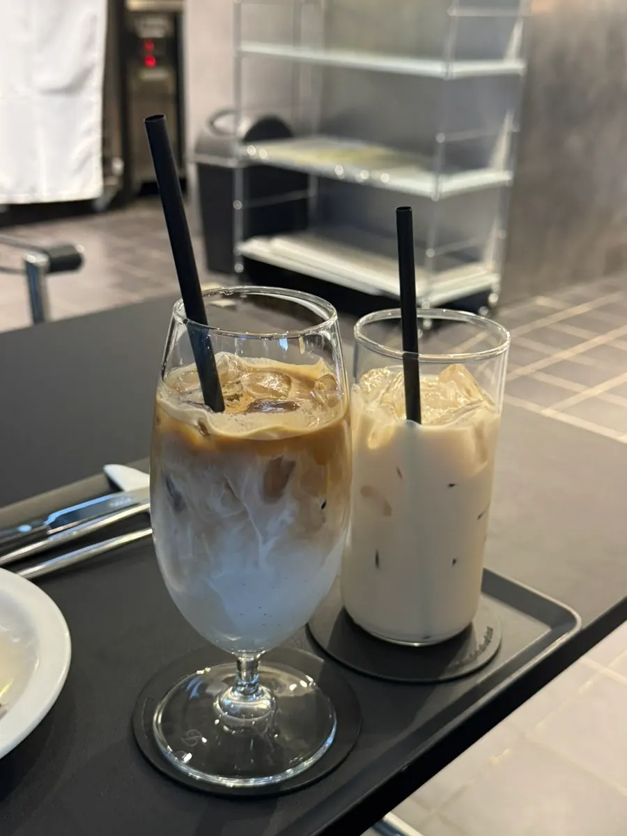 Three drinks and a dessert plate on the table